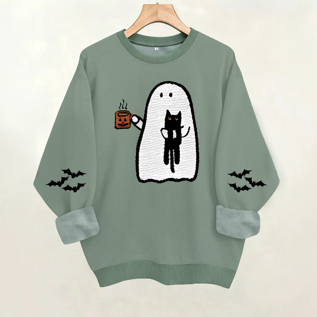 Ghost holding black cat with fleece hoodie
